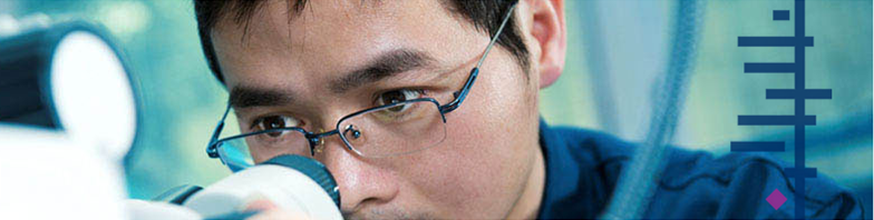Image of a man looking into a microscope with the Cochrane logo